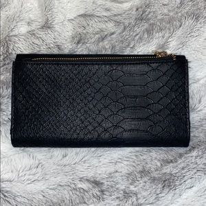 medium black snakeskin clutch - good condition